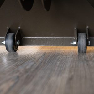 close up of base of wheels on stand